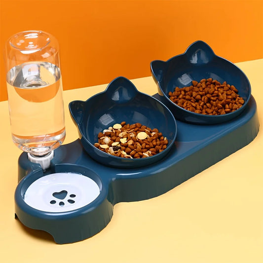 Pet feeding station with two bowls of food and a glass of water on an orange background