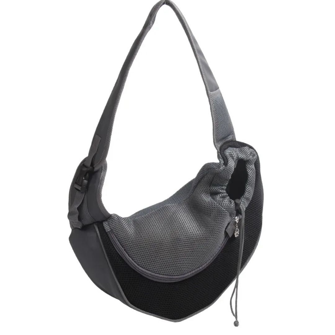 Black and gray pet carrier with mesh side on a white background