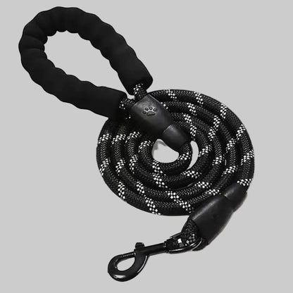 Black dog leash with paw-shaped clip on a gray background