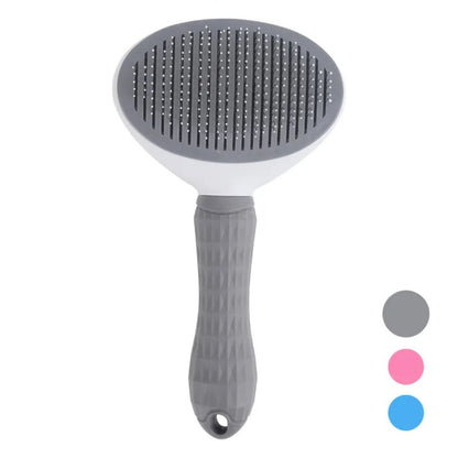 Pet grooming brush with gray bristles and handle on a white background