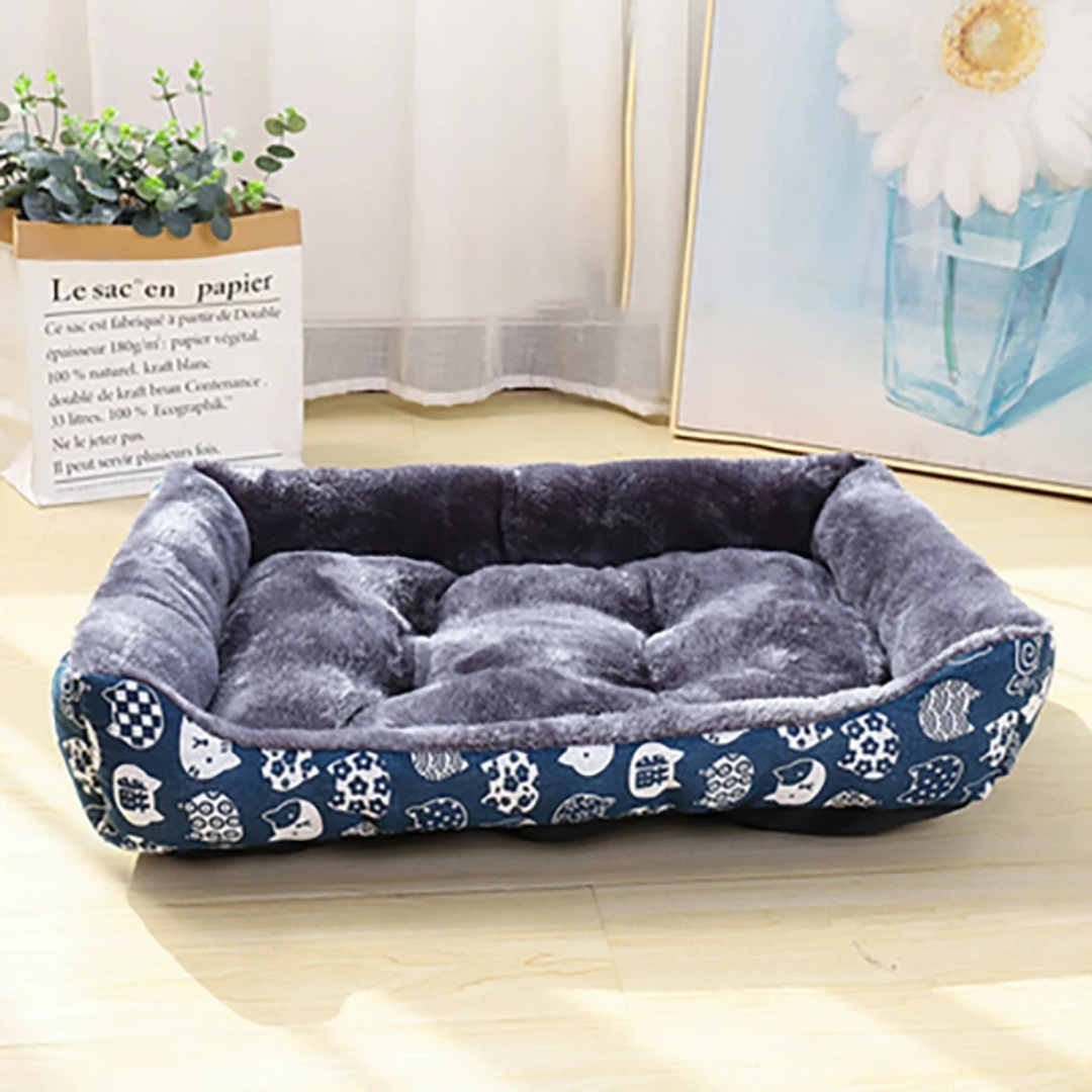 Dog bed with floral pattern on a wooden floor