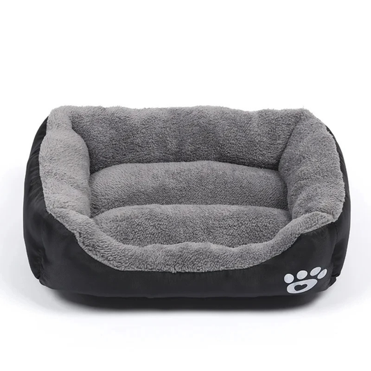 Pet bed with gray interior and black exterior on a white background