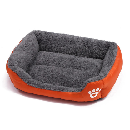 Gray and orange pet bed with a paw print logo on a white background