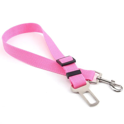 Adjustable nylon pet car seat belt safety leash for dogs and cats with quick-release buckle, helping keep pets secure and comfortable during car travel.